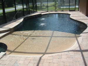 Custom Residential Pool with Beach Entry and two tone pebble finish