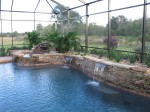 Custom Residential Pool & Spa with rock features and sheet descent