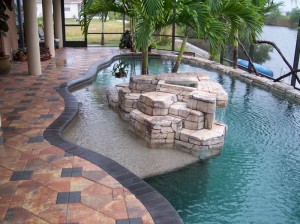 Faux rock island with bishops hat pavers