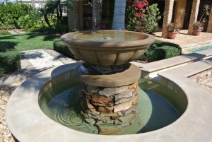 Fountain with trough to swimming pool