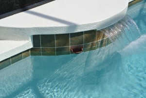 Sheer Descent fountain with tile wrapped beam textured deck